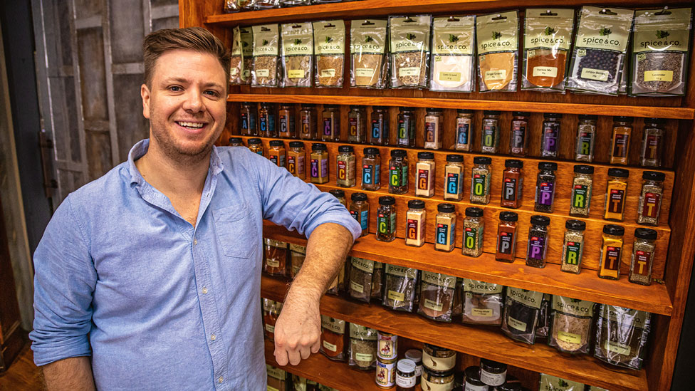 Michael Weldon next to spice rack