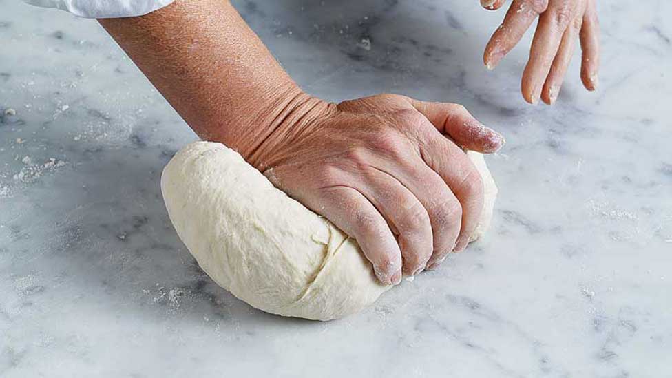 Kneading the dough firmly