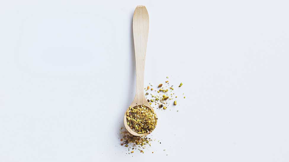 Pistachio dukkah in a spoon