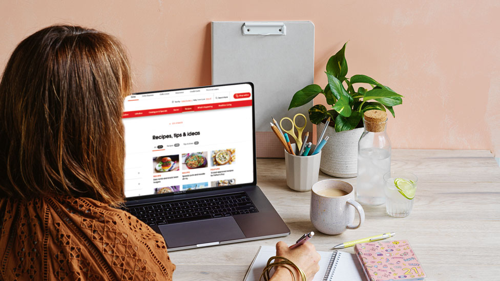 Woman browsing the Coles website