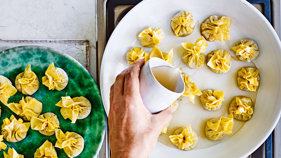 Frying a batch of dumplings