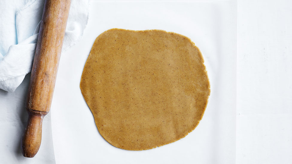 Roll out dough portion on a baking paper