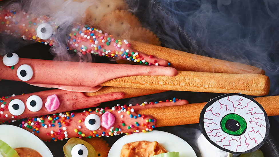 Breadstick monsters decorated with sprinkles