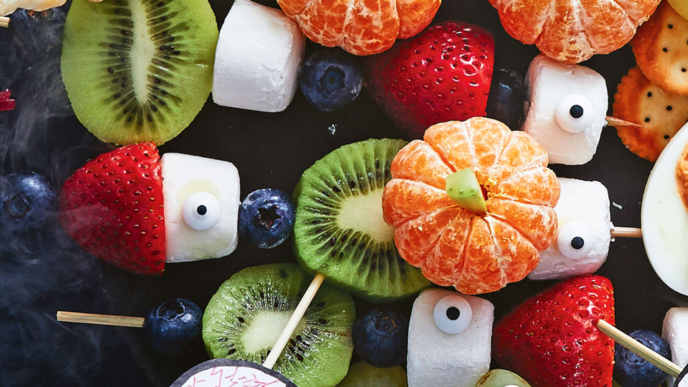 Fruit skewers on a halloween platters 