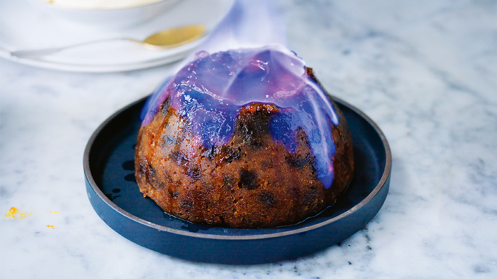 A Christmas pudding on fire