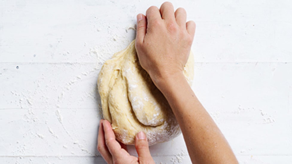 Use the heel of your hand to knead the dough