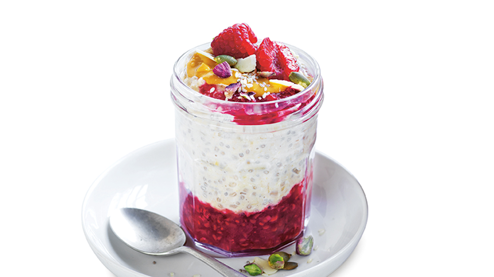 Jar of overnight oats with raspberries on top