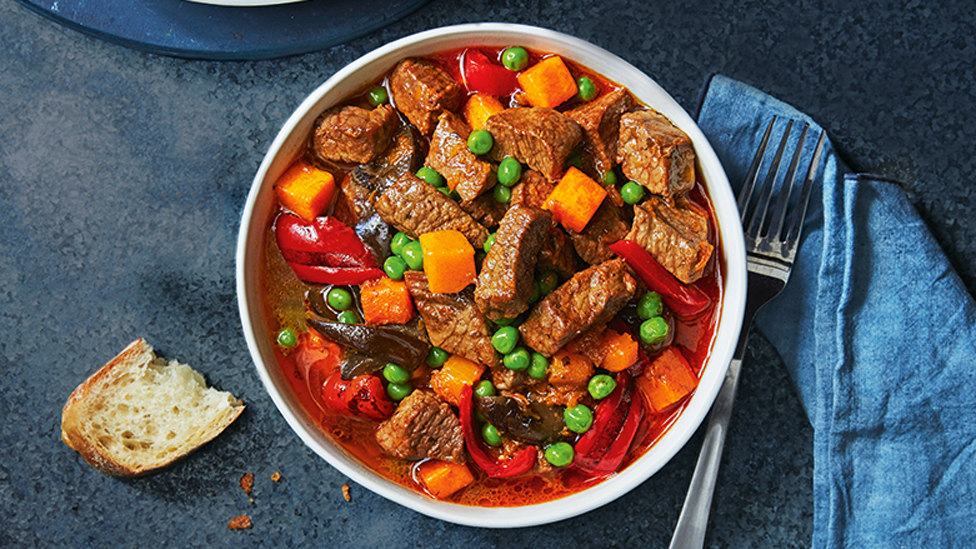 Beef and pumpkin stew with toasted bread in the side