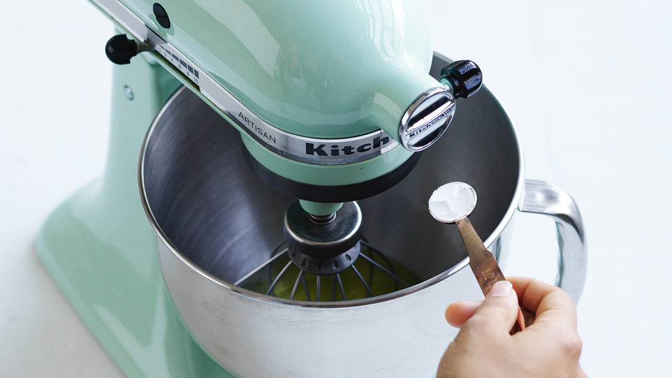 Egg whites being whisked in an electric mixer
