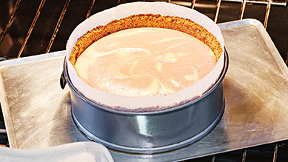 Half baked cheesecake in the oven