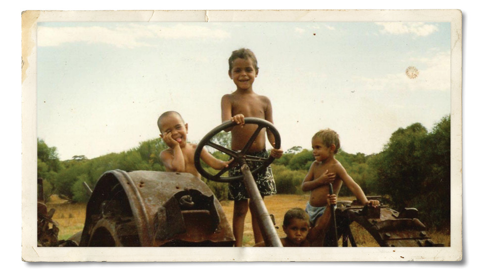 Eddie Betts with his cousins on a old tractor