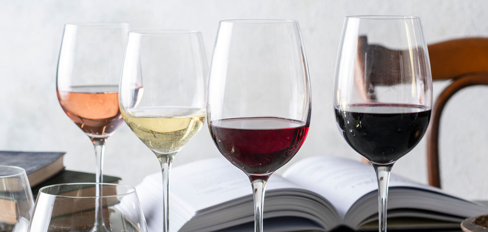 Pink, white and red varietals of wine in glasses