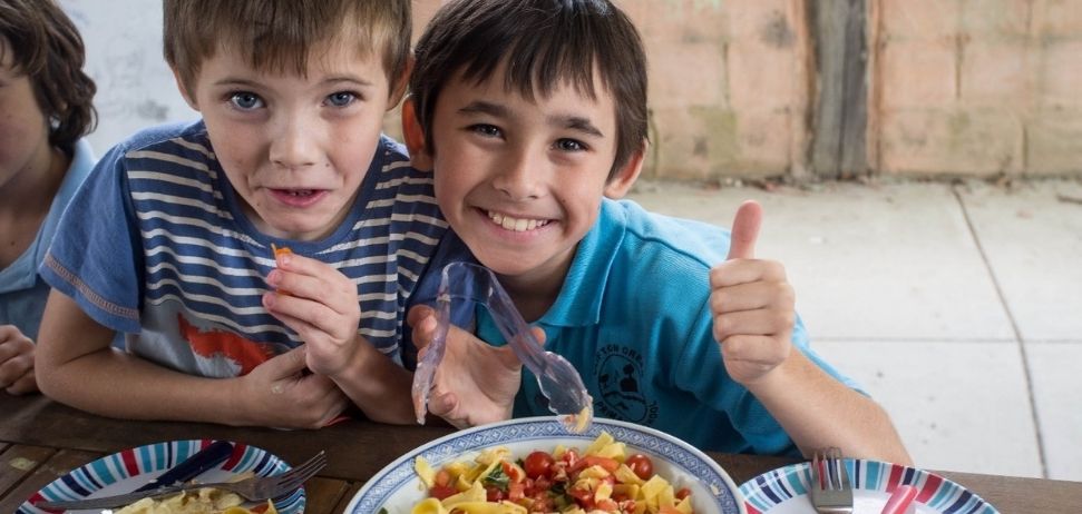 Two children enjoying a meal at the Stephanie Alexander Kitchen Gardefn Foundation