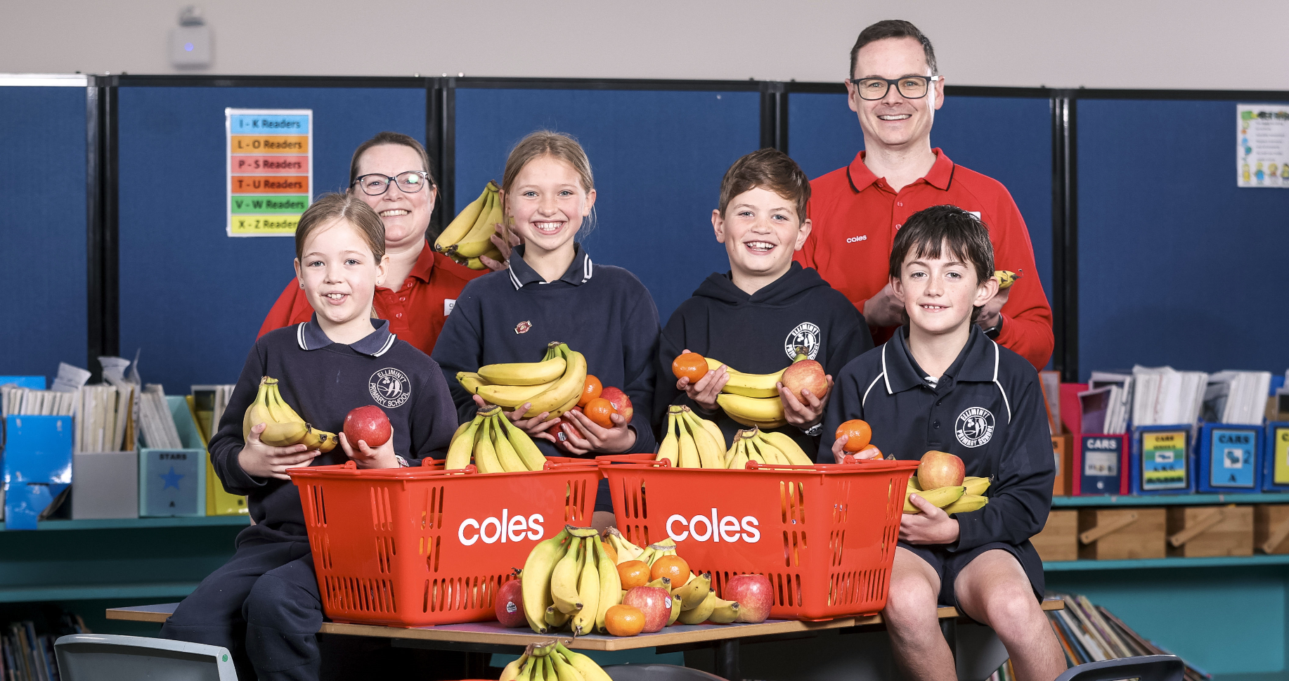 Two Coles staff members