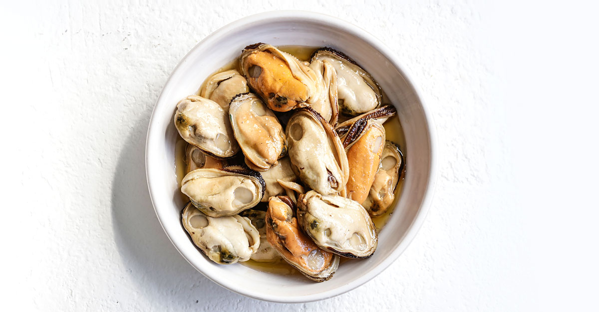 Raw mussel meat in a small bowl
