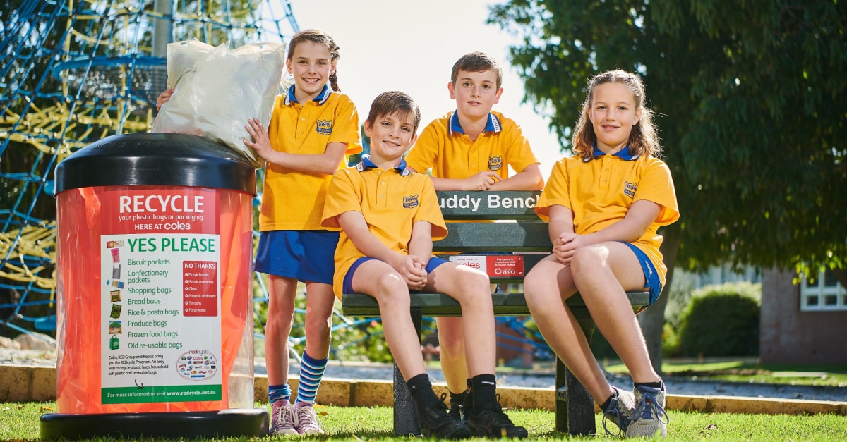 Marmion Primary School's Eco Commandos with their new Buddy Bench made from soft plastics collected in REDcycle bins at Coles