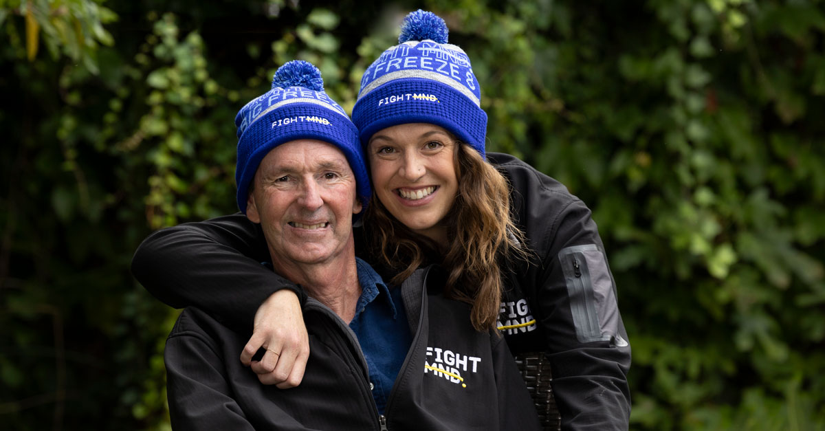 Two people with Fight MND beanies