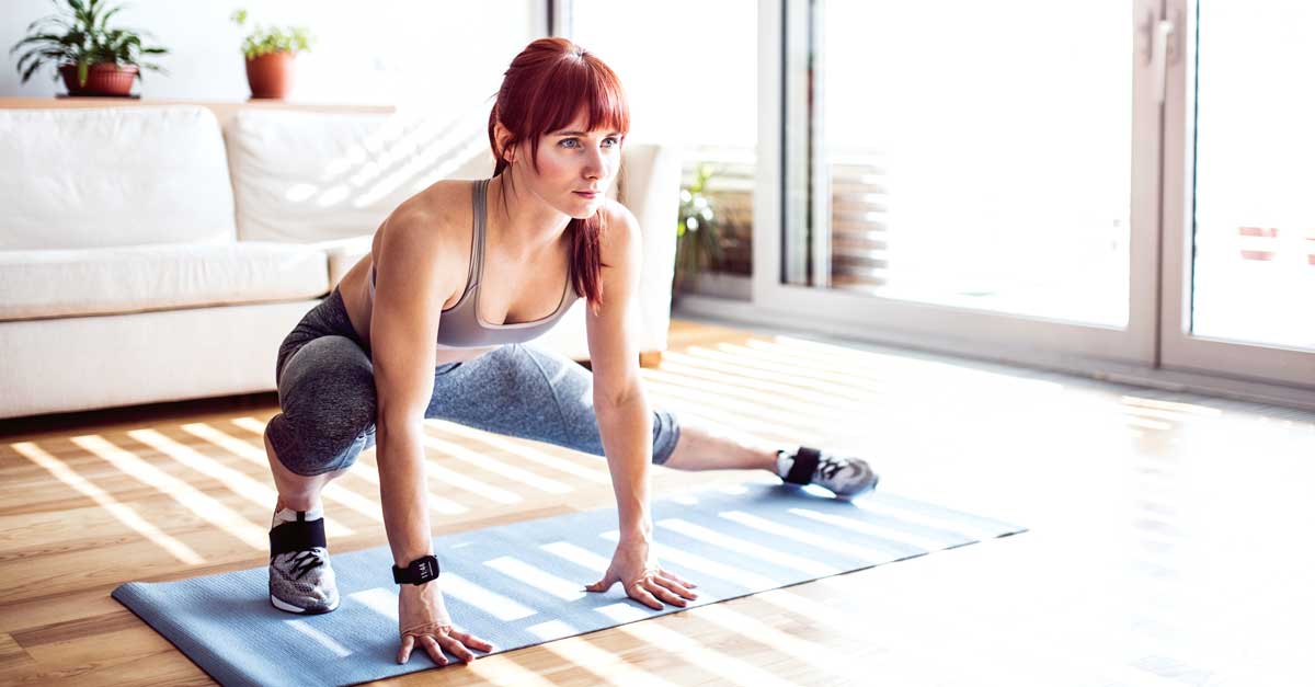 Young lady doing yoga indoor