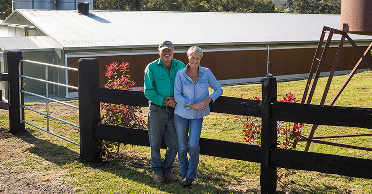 Shane and Susan Snowdon standing next to a paddock at their Stroud Valley, NSW, property